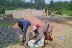 Women building school